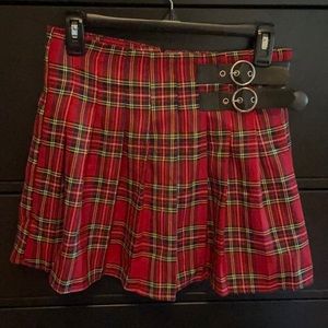 Short, thigh length, plaid skirt. Worn twice at most.